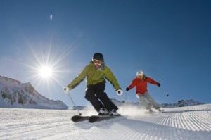 Skier in action with the sun behind
